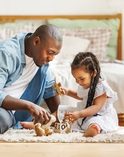 Clinician working with a young child at home